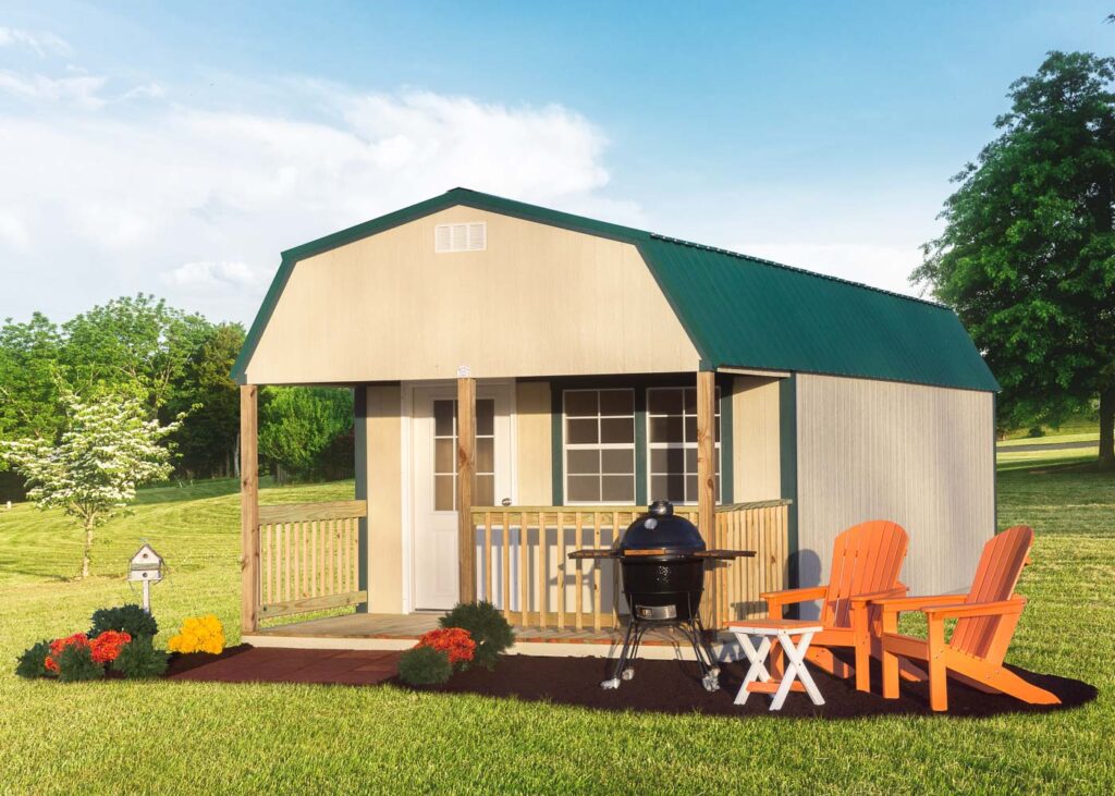 Tan Lofted Cabin with green roof by Miller's Mini Barns